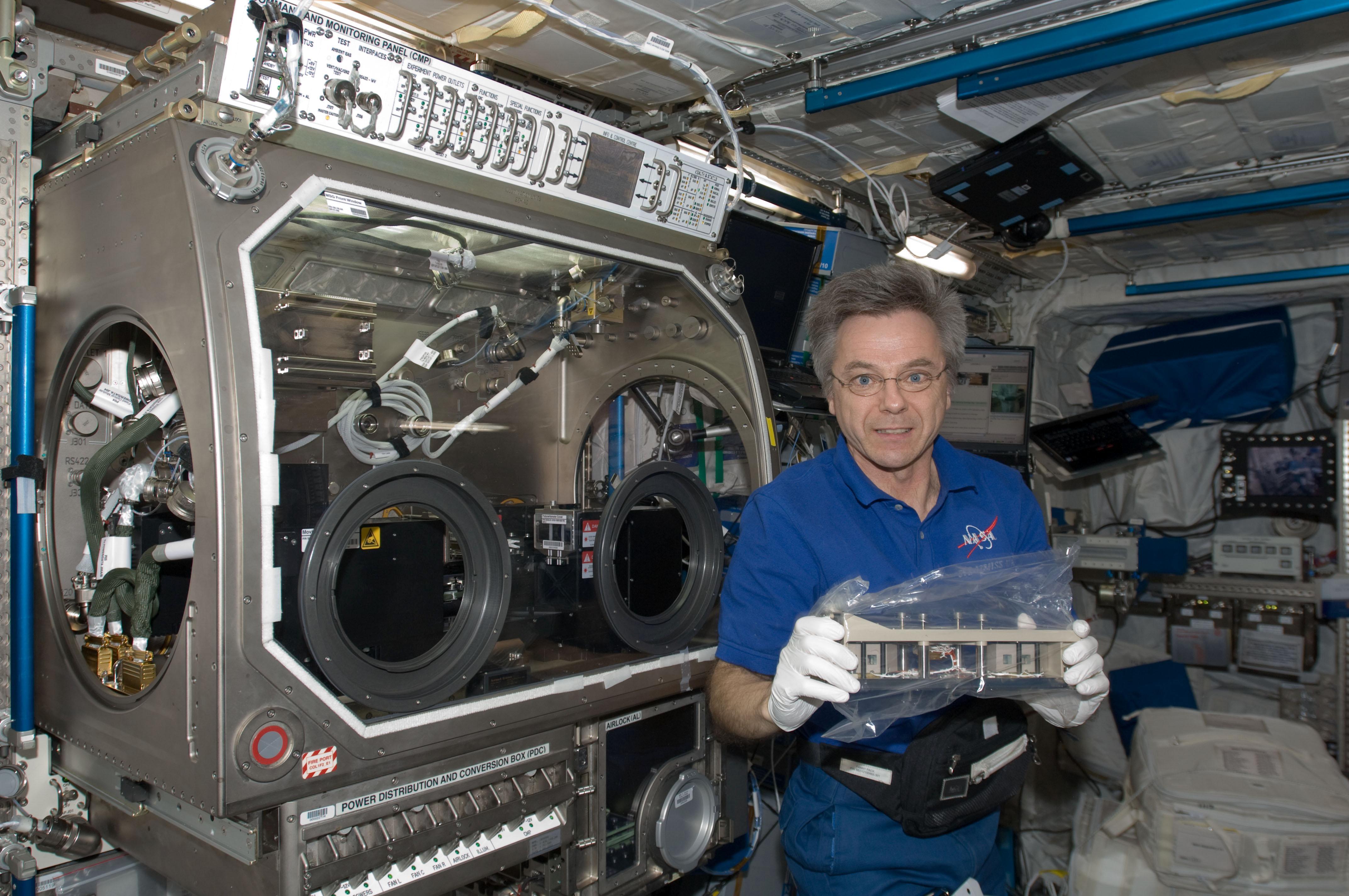 Robert Thirsk working with the Selectable Optical Diagnostics Instrument